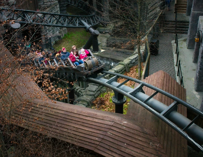 Roller coaster cars with riders on a track